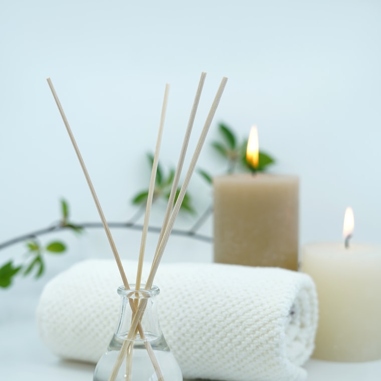 Folded spa towels with candles